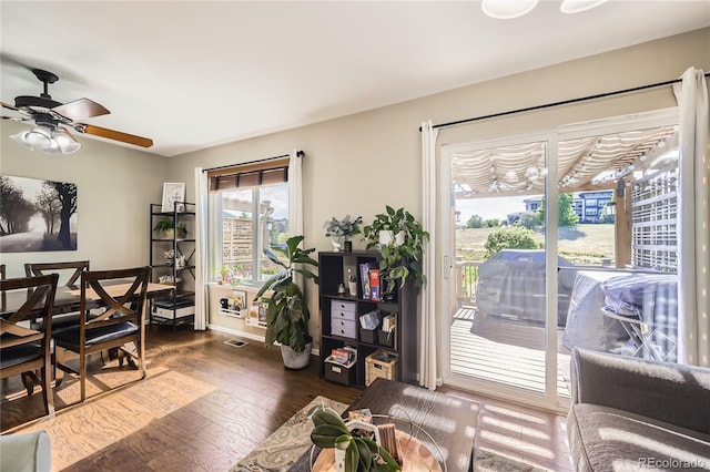 1974 E 102nd Cir, Thornton, CO 80229 - living room featuring dark wood-type flooring and a ceiling fan