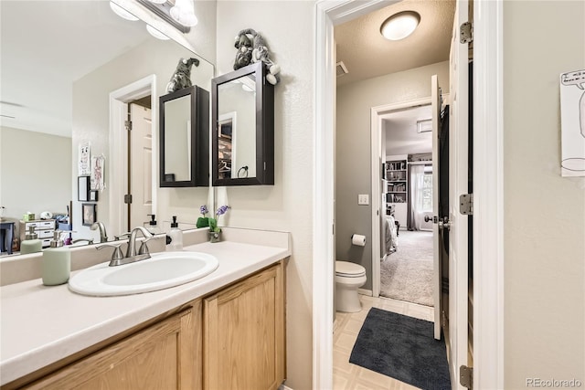 1974 E 102nd Cir, Thornton, CO 80229 - bathroom with vanity, tile patterned flooring, and ensuite bathroom