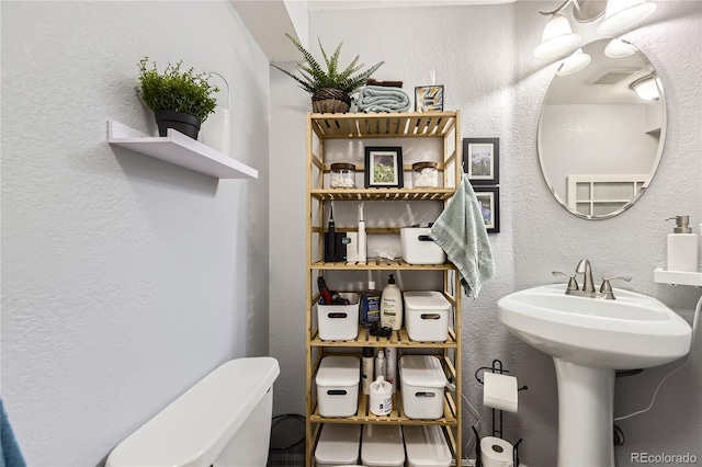 1974 E 102nd Cir, Thornton, CO 80229 - bathroom with a textured wall and toilet