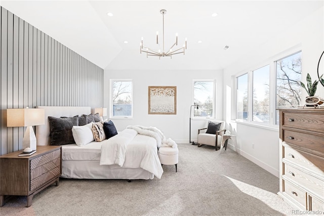 bedroom with a notable chandelier, light carpet, and vaulted ceiling