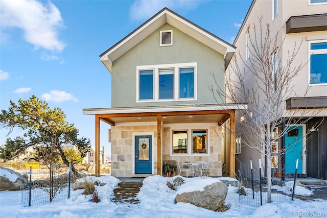 485 E Arkansas St, Buena Vista, CO 81211 - view of front of property featuring stone siding, stucco siding, and a porch
