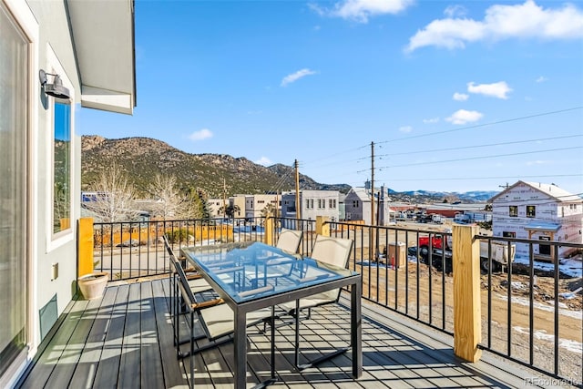 485 E Arkansas St, Buena Vista, CO 81211 - wooden terrace with a mountain view, outdoor dining area, and a residential view