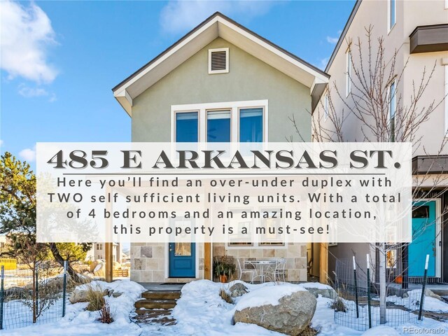 485 E Arkansas St, Buena Vista, CO 81211 - view of snowy exterior featuring stucco siding and stone siding