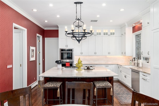 4 Cherry Hills Farm Dr, Cherry Hills Village, CO 80113 - kitchen featuring a sink, appliances with stainless steel finishes, crown molding, dark wood-style floors, and a center island