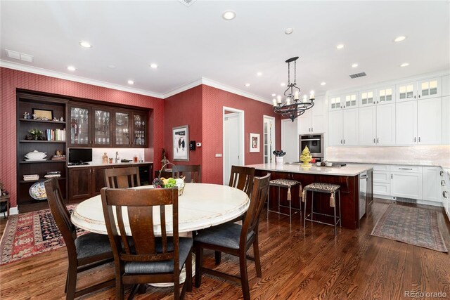 4 Cherry Hills Farm Dr, Cherry Hills Village, CO 80113 - dining room featuring a chandelier, recessed lighting, dark wood-type flooring, and crown molding