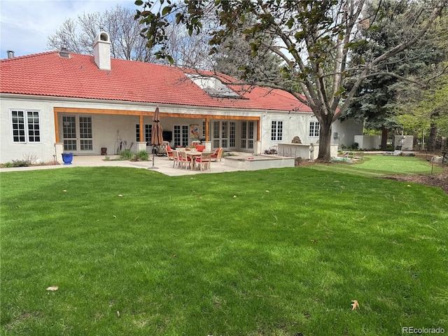 4 Cherry Hills Farm Dr, Cherry Hills Village, CO 80113 - rear view of property with french doors, a tiled roof, a lawn, a chimney, and a patio