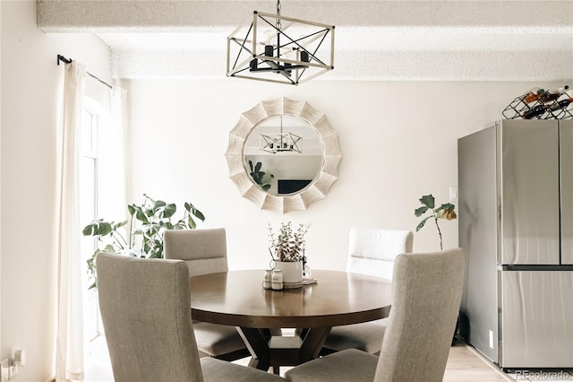 1365 Columbine St Unit 204, Denver, CO 80206 - dining space featuring a chandelier and wood finished floors