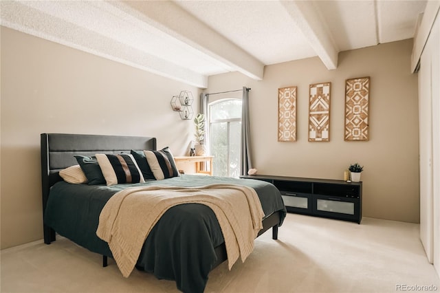 1365 Columbine St Unit 204, Denver, CO 80206 - bedroom featuring carpet floors and beamed ceiling