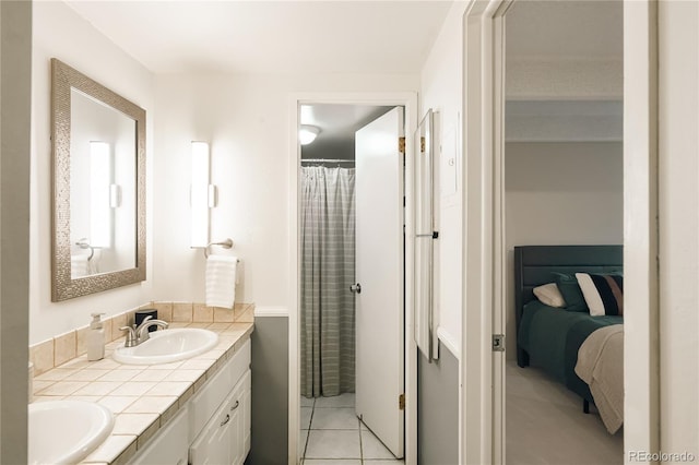 1365 Columbine St Unit 204, Denver, CO 80206 - ensuite bathroom with double vanity, tile patterned flooring, and a shower with curtain