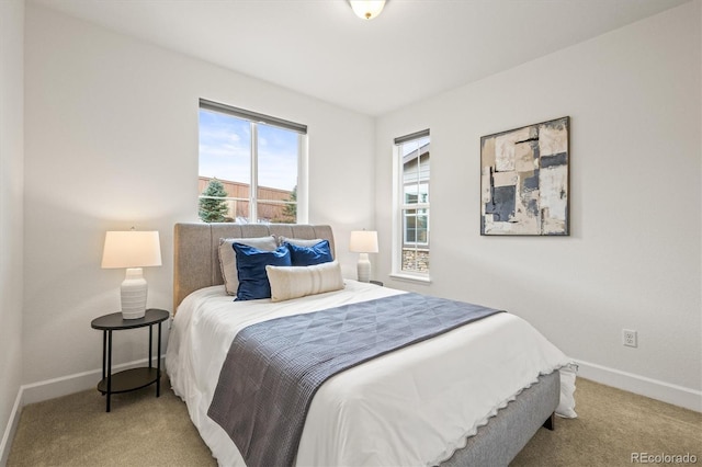 bedroom featuring light carpet