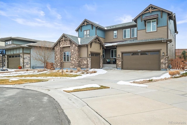 7875 S Grand Baker St, Aurora, CO 80016 - view of front of house with board and batten siding, stone siding, a garage, and driveway