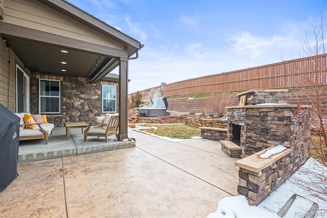 7875 S Grand Baker St, Aurora, CO 80016 - view of patio / terrace with an outdoor stone fireplace