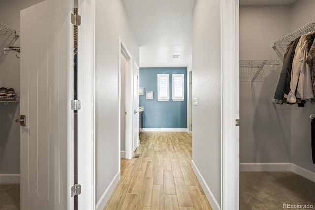 7875 S Grand Baker St, Aurora, CO 80016 - hallway with light wood-style flooring and baseboards