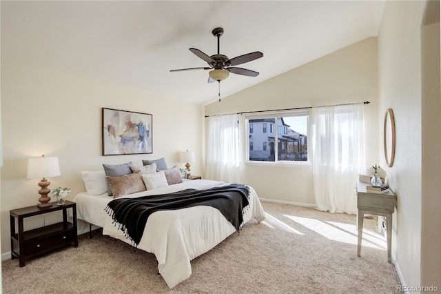 bedroom featuring baseboards, carpet, ceiling fan, and vaulted ceiling