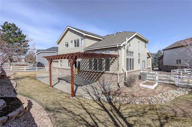 rear view of house featuring a pergola, a fenced backyard, cooling unit, a shingled roof, and a patio area