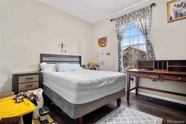 bedroom featuring dark hardwood / wood-style floors