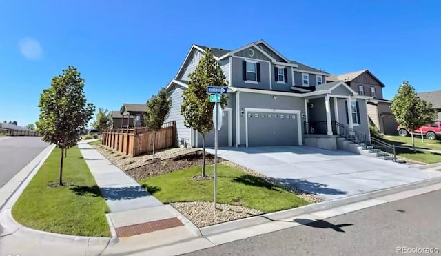 view of front of house with a front lawn and a garage