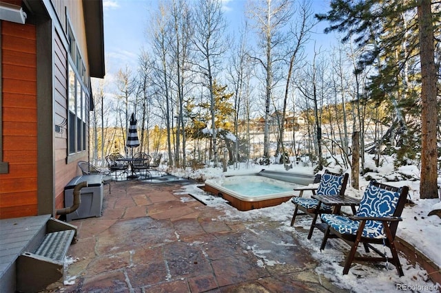 view of patio / terrace with a hot tub and outdoor dining area