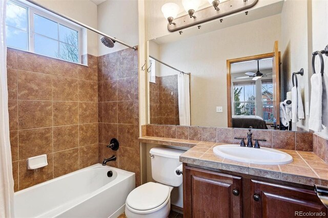 bathroom featuring ensuite bathroom, shower / bathtub combination, toilet, and a healthy amount of sunlight