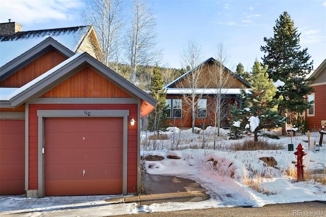 view of snow covered garage