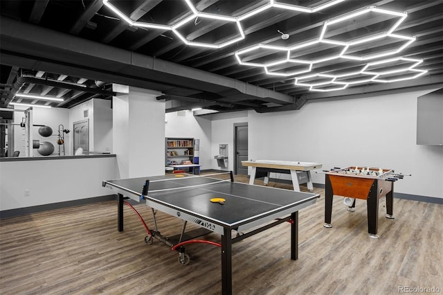 playroom featuring wood finished floors and baseboards