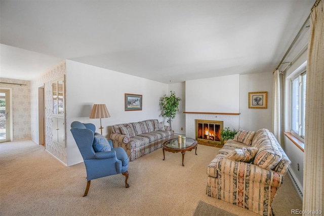 living area with a wealth of natural light, carpet flooring, a fireplace, and a baseboard radiator