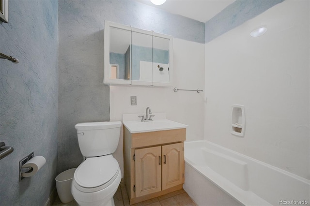 full bath with a tub to relax in, a textured wall, vanity, and toilet