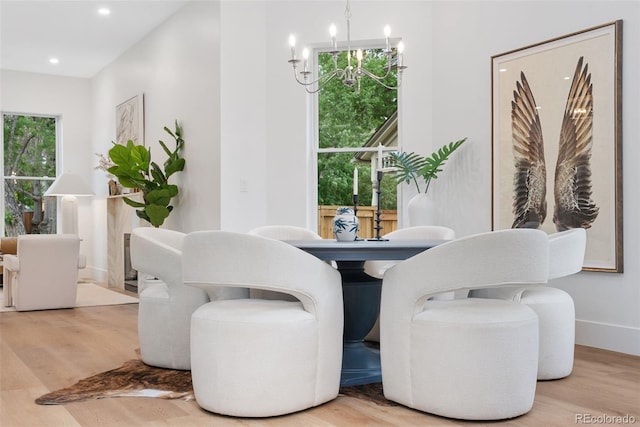 2351 N Emerson St, Denver, CO 80205 - living area featuring wood finished floors, plenty of natural light, a chandelier, and recessed lighting
