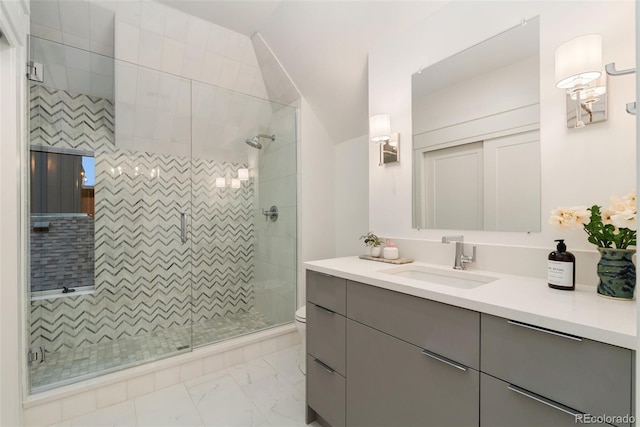 2351 N Emerson St, Denver, CO 80205 - full bath featuring marble look tiles, a shower stall, and toilet