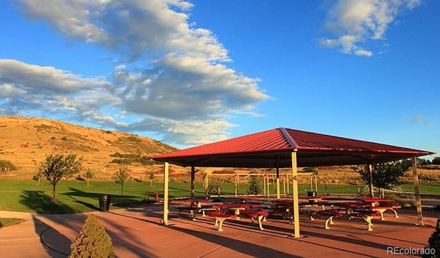 surrounding community featuring a gazebo and a mountain view