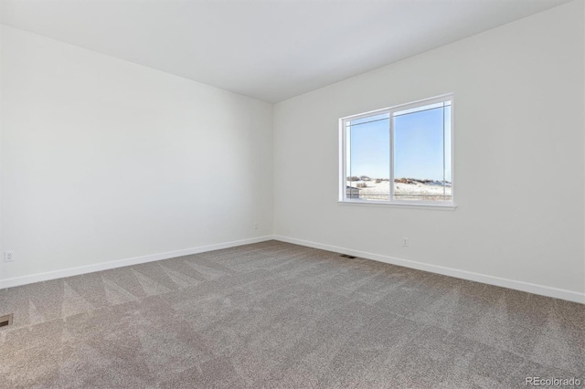 unfurnished room with carpet floors