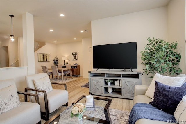 living area featuring wood finished floors and recessed lighting