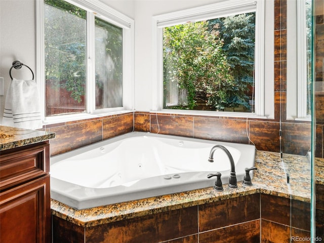 9464 E Aspen Hill Pl, Lone Tree, CO 80124 - bathroom with a tub with jets and vanity