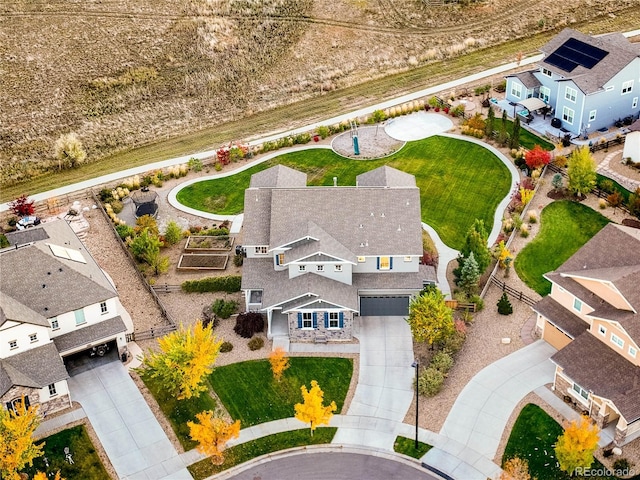 birds eye view of property with a residential view