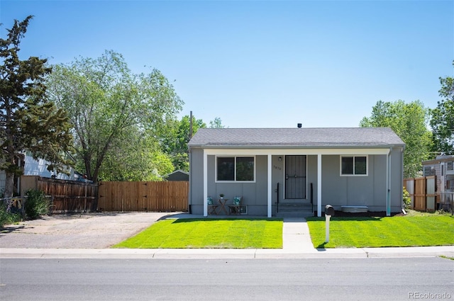 7870 Magnolia St, Commerce City, CO 80022 - view of front of property featuring covered porch, board and batten siding, and a gate
