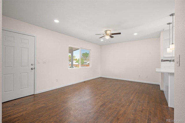7870 Magnolia St, Commerce City, CO 80022 - unfurnished living room with ceiling fan, dark wood-style flooring, baseboards, and recessed lighting
