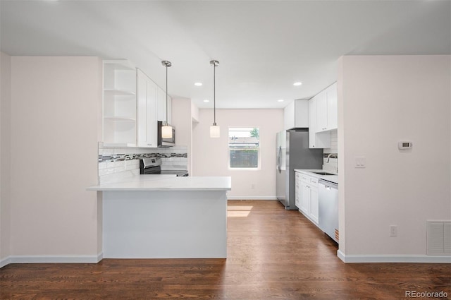 7870 Magnolia St, Commerce City, CO 80022 - kitchen featuring appliances with stainless steel finishes, open shelves, tasteful backsplash, white cabinetry, and recessed lighting
