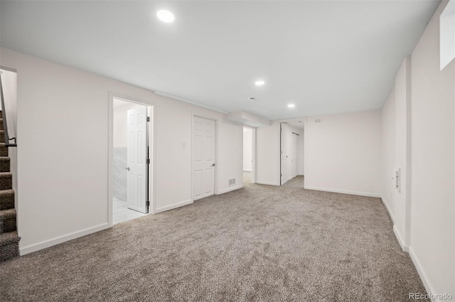 7870 Magnolia St, Commerce City, CO 80022 - finished basement with stairs, recessed lighting, carpet, and baseboards