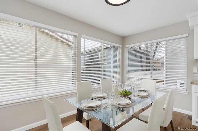 dining area with hardwood / wood-style flooring