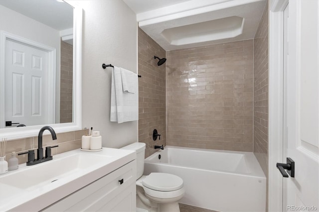 full bathroom featuring toilet, tub / shower combination, backsplash, and vanity