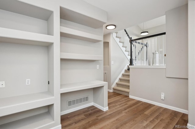 interior space with hardwood / wood-style floors