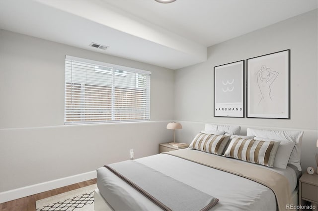 bedroom with wood-type flooring