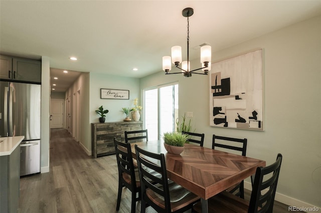 1450 Syracuse St, Denver, CO 80220 - dining room featuring a chandelier, wood finished floors, baseboards, and recessed lighting