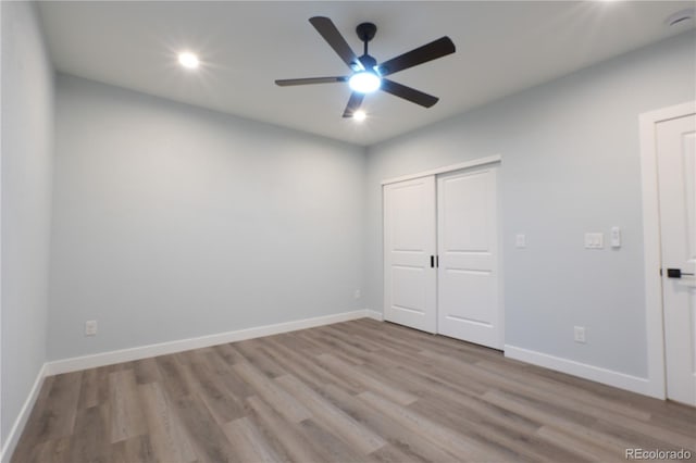 1450 Syracuse St, Denver, CO 80220 - unfurnished bedroom with wood finished floors, recessed lighting, baseboards, a closet, and ceiling fan