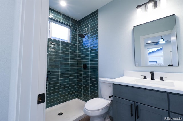 1450 Syracuse St, Denver, CO 80220 - full bathroom with vanity, toilet, and tiled shower