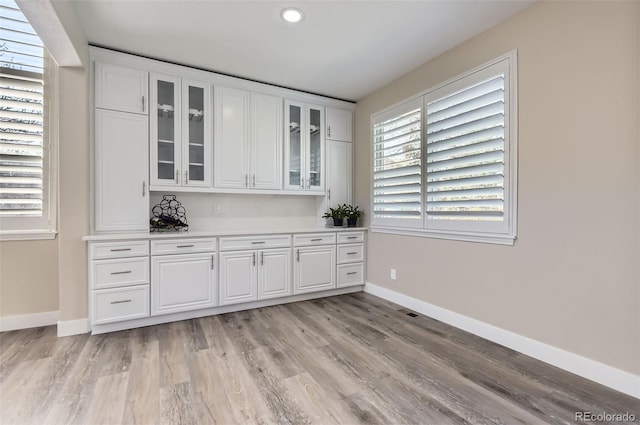 bar with light wood-style floors, baseboards, recessed lighting, and visible vents