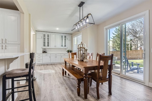 dining area featuring recessed lighting and light wood-style flooring