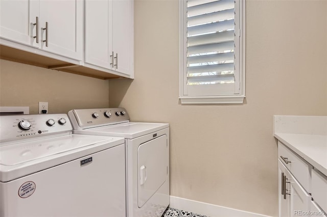 laundry area featuring washer and dryer and cabinet space