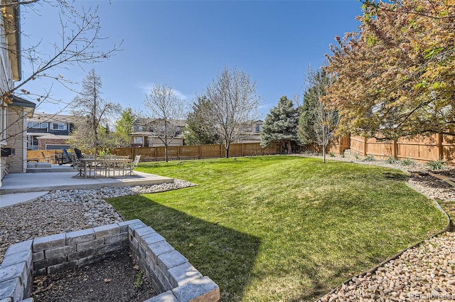 view of yard with a fenced backyard and a patio area