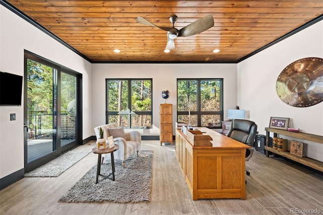 office space featuring ceiling fan, wooden ceiling, light wood-style flooring, baseboards, and crown molding